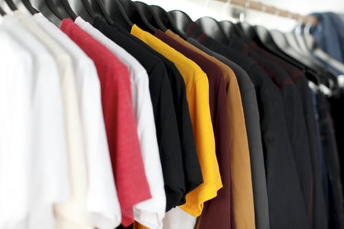 clothing rack of multicolored shirts